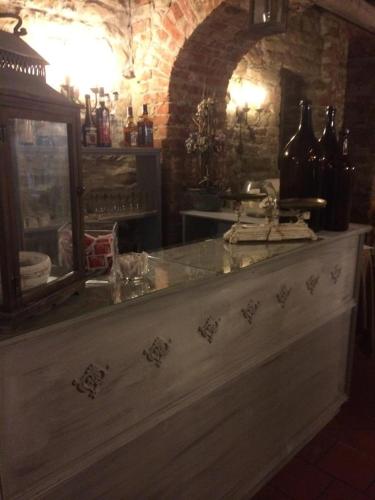 a kitchen with a counter with a sink and a mirror at Castello di Trisobbio in Trisobbio