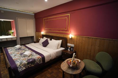Ένα ή περισσότερα κρεβάτια σε δωμάτιο στο Mount Conifer Suites & Spa