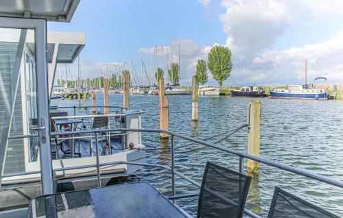 a boat is docked at a marina with boats at Havenlodge Lelystad in Lelystad