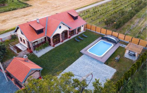 an aerial view of a house with a swimming pool at Nice Home In Karanac With Sauna in Karanac