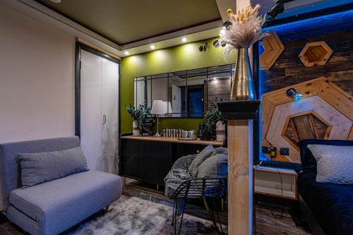 a bedroom with a desk and a chair and a mirror at Central London Hub in London