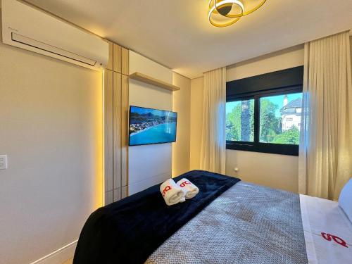 Cama ou camas em um quarto em Monte Lussari 203A - Apê NOVO no Bavária Gramado