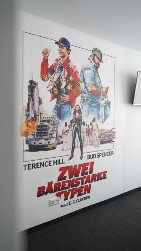 a poster for a movie on a wall at Amical Hotel Hagen - Am Hauptbahnhof in Hagen