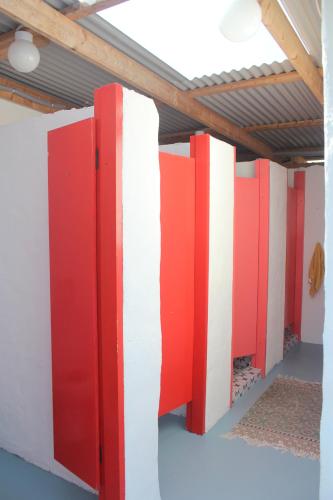 a room with red and white walls and a ceiling at Valentia Island Escape in Valentia Island