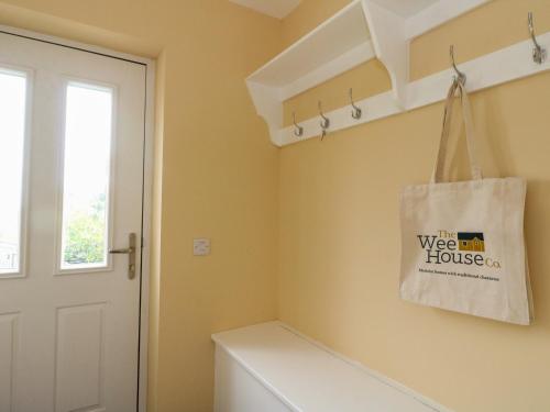 a laundry room with a bag on the wall at Tirlaggan Úr in Oban