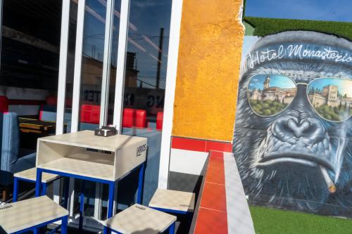 a mural of a gorilla with glasses on a building at Hotel Monasterio Granada - Adults Only in Granada