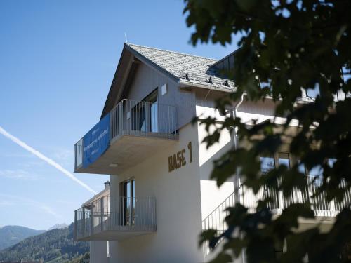a building with two balconies on the side of it at BASECAMP Reiteralm in Schladming