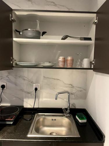a kitchen with a sink and a counter top at Ista Vacation Homes Rental LLC in Dubai