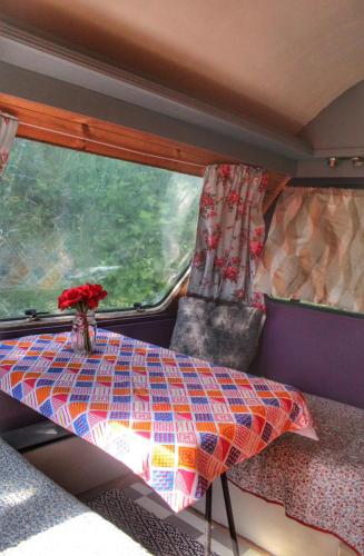 a table in the back of a train with a window at Valentia Island Escape in Valentia Island