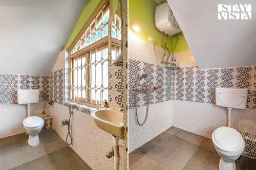 a bathroom with a sink and a toilet and a window at StayVista at Luitel Homestay with Mountain View in Gangtok