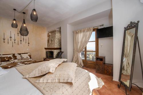 Кровать или кровати в номере Archontiko Fiamegou Hotel&Spa