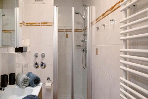 a bathroom with a shower and a sink at Almzeit in Farchant