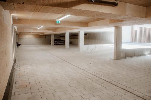 an empty parking lot in an empty parking garage at Boutique Hotel GreenLeaf in Sinzing