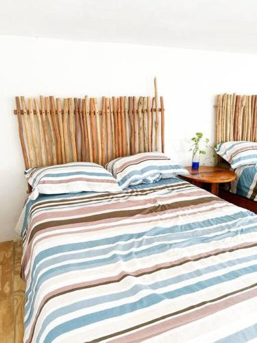 Ένα ή περισσότερα κρεβάτια σε δωμάτιο στο Loft con hermosa vista, terraza y wifi Starlink!