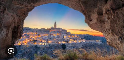 a view of a city seen through a rock formation at Casa del sole in Nova Siri Marina
