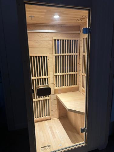 a small wooden cage with a chair in it at Villa Cecilia Luxury Stay in Kastoria