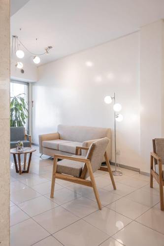 a living room with a couch and a table at Dorrego Premium in Rosario