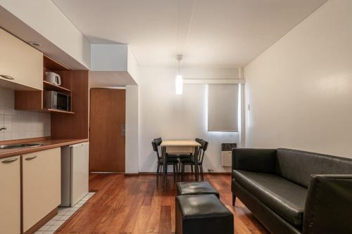 a living room with a couch and a table at Dorrego Premium in Rosario