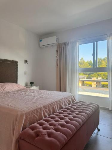 Ένα ή περισσότερα κρεβάτια σε δωμάτιο στο Duplex con pileta