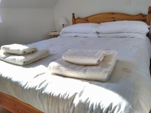 Postel nebo postele na pokoji v ubytování Old Dairy Cottage