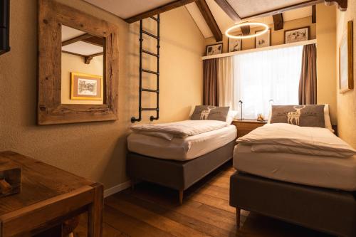 Postel nebo postele na pokoji v ubytování Elfi - luxury mountain bijou by Inspiringplaces Zermatt