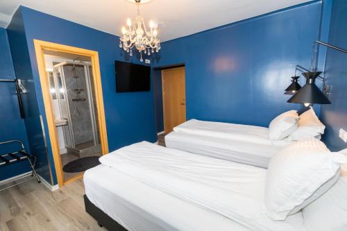 Postel nebo postele na pokoji v ubytování Hotel North