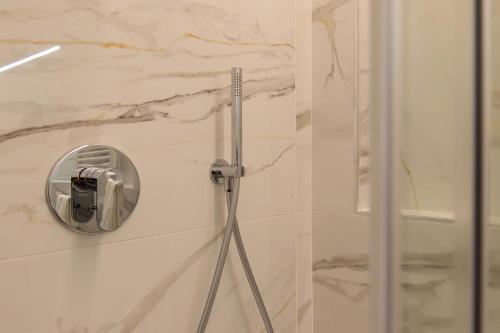 a bathroom with a shower with a mirror on the wall at Tramonto sul Lago in Passignano sul Trasimeno
