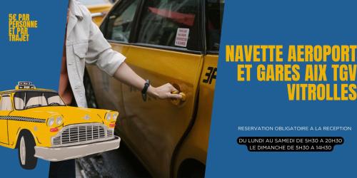 a man is standing next to a yellow taxi at Première Classe Aéroport Marseille in Vitrolles