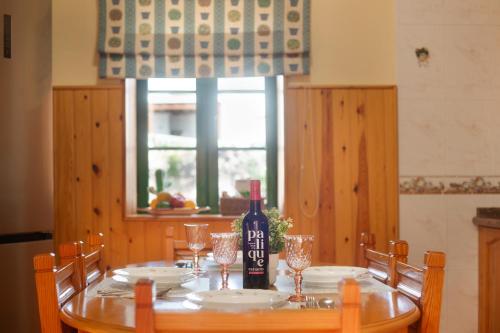 a bottle of wine sitting on top of a table at Casa Dayaday in Puerto del Rosario