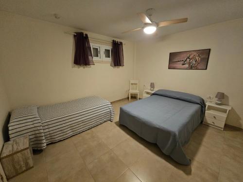 A bed or beds in a room at Perfect Getaway in Los Gigantes, Shared Pool-WiFi