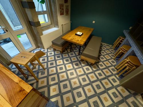 an overhead view of a room with a table and chairs at Sardines and Friends Hostel 04 in Póvoa de Varzim