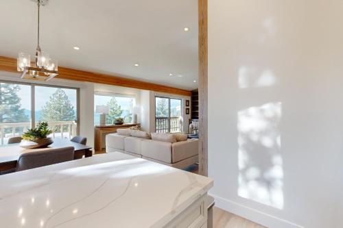 a kitchen and living room with a couch and a table at Towering Pine in Incline in Incline Village