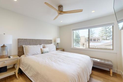 a bedroom with a large bed and a window at Towering Pine in Incline in Incline Village