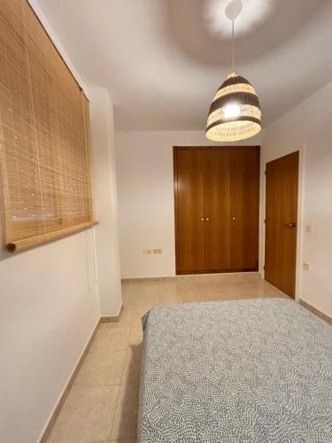 Katil atau katil-katil dalam bilik di Apartamento en el Grao de Gandía