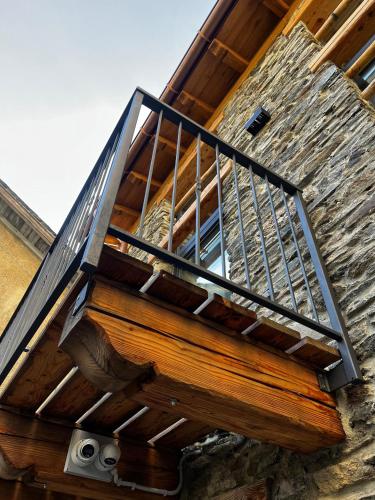 a wooden staircase with a metal railing on a building at Chalet Letizia Mountain and Relax - Your Mountain Holiday in Premana
