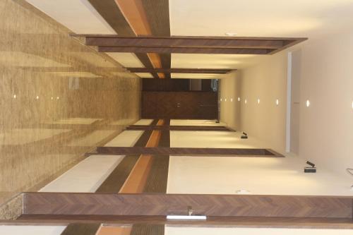 a hallway of a building with wooden ceilings at Hotel Metro Inn in Mumbai