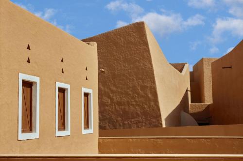 a building with white windows on the side of it at Bab Samhan, a Luxury Collection Hotel, Diriyah in Riyadh