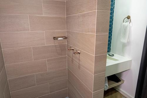 a bathroom with a shower and a sink at Faranda Collection Cali, a member of Radisson Individuals in Cali