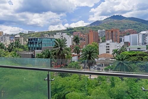 a view of a city with buildings and a mountain at Faranda Collection Cali, a member of Radisson Individuals in Cali