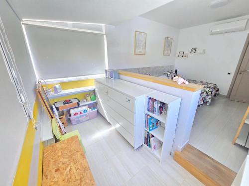 a childs room with a desk and a bed at Oasis House in Maspalomas