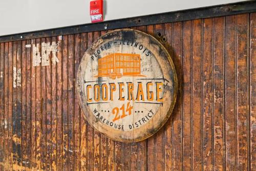 a sign on the side of a wooden wall at Chic Loft in Peoria Warehouse District in Peoria