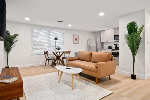 a living room with a couch and a table at The Silo 5- 1 BD Urban Haven in Morton