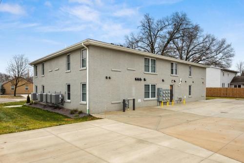 a large gray building with a parking lot at The Silo 5- 1 BD Urban Haven in Morton