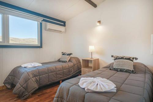 Postel nebo postele na pokoji v ubytování A11- Tranquilidad en la Patagonia