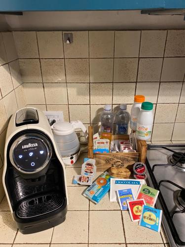 a kitchen counter with a toaster and some food at Lucy house in Ronciglione