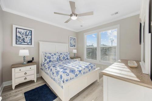 a bedroom with a bed and a window at Channel Catch in Myrtle Beach
