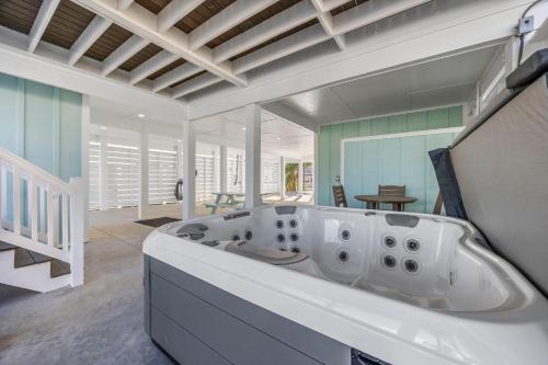a large white bath tub in a room at Channel Catch in Myrtle Beach
