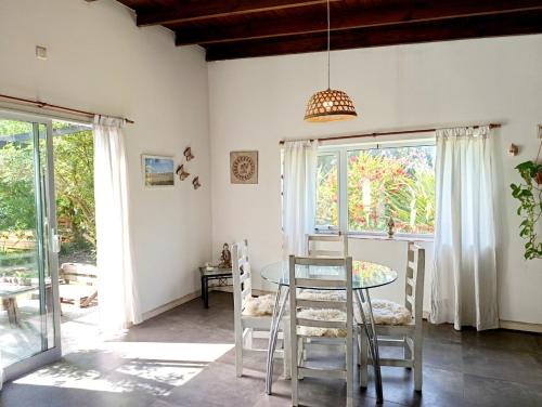 a dining room with a table and chairs at Loft en Los Acantilados in Mar del Plata