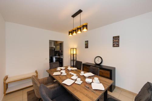 a dining room with a wooden table and chairs at Fuldaer Residenz in Fulda