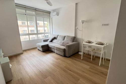 a living room with a couch and a table at Estudio Pastora in Torremolinos